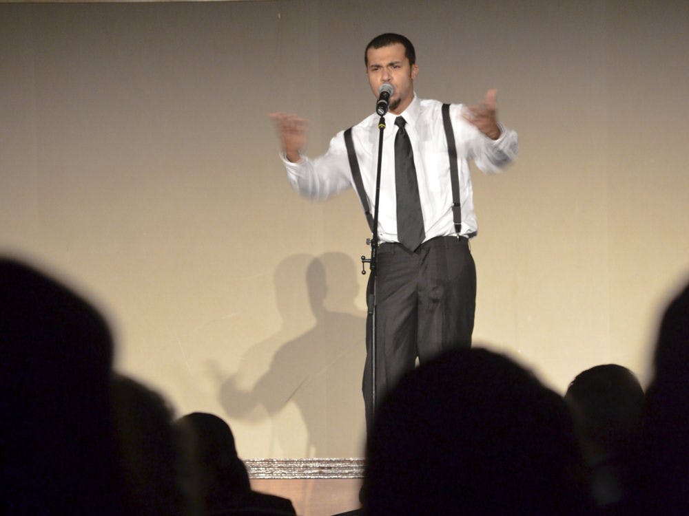 A spoken word artist performs during UF’s Hispanic Heritage Month Opening Ceremony on Wednesday in the Reitz Union Grand Ballroom.