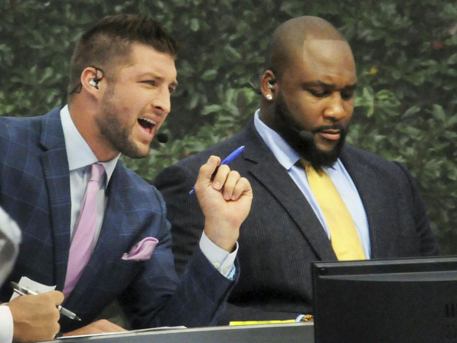 Former Florida quarterback Tim Tebow (left) speaks during the SEC Nation broadcast on Sept. 26, 2015, on UF's Plaza of the Americas.