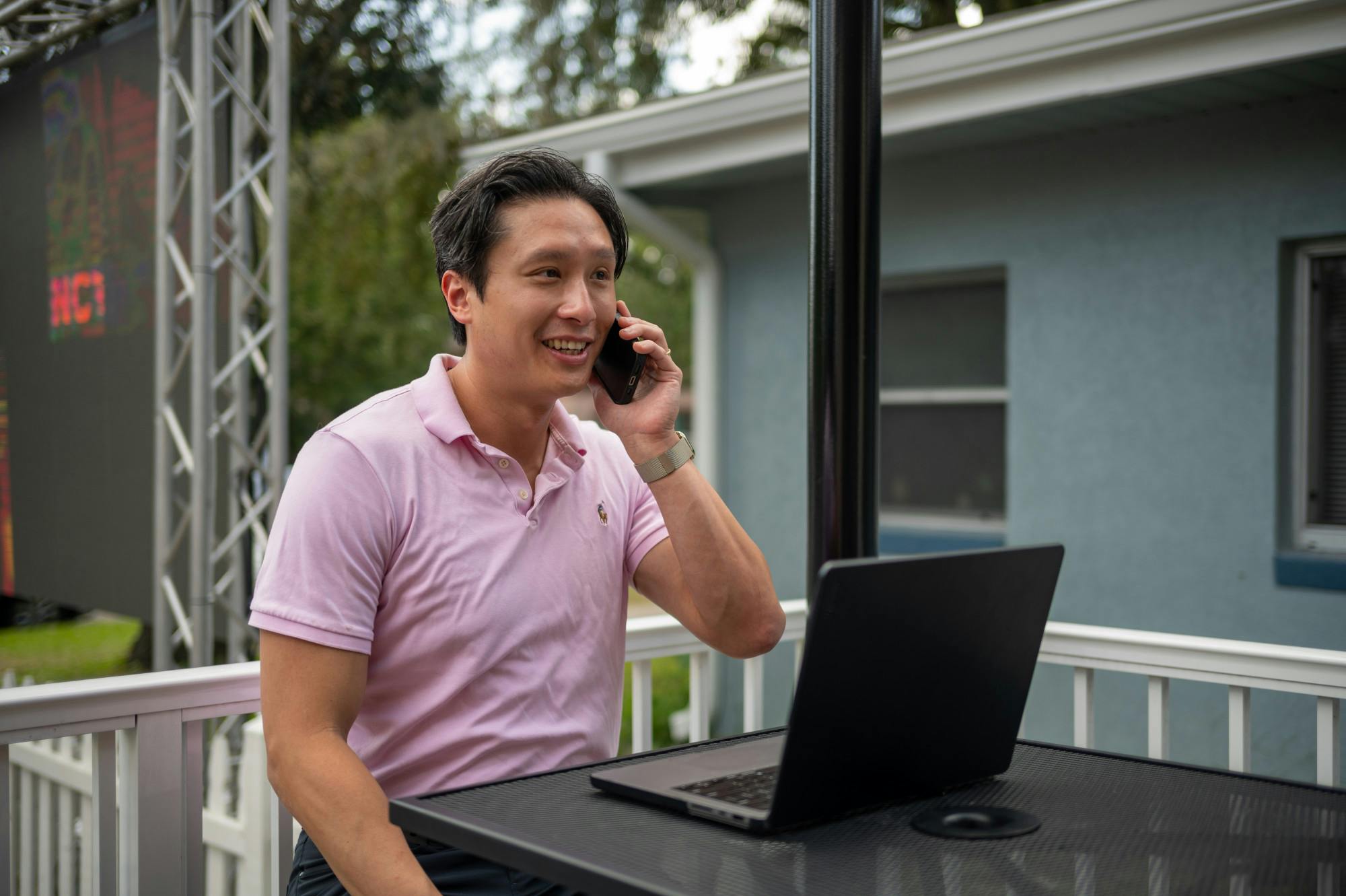 Thomas Vu, candidate for Alachua County School Board, takes a phone call at The Swamp Restaurant on Oct. 21, 2024, in Gainesville, Florida. 