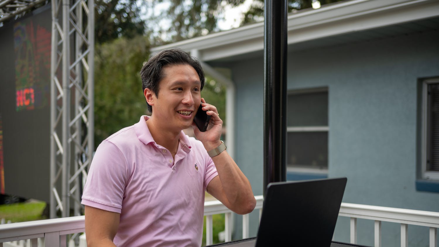 Thomas Vu, candidate for Alachua County School Board, takes a phone call at The Swamp Restaurant on Oct. 21, 2024, in Gainesville, Florida.