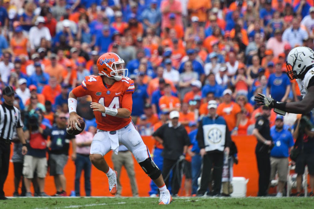 UF quarterback Luke Del Rio scrambles during Florida's 38-24 win against Vanderbilt on Saturday at Ben Hill Griffin Stadium.