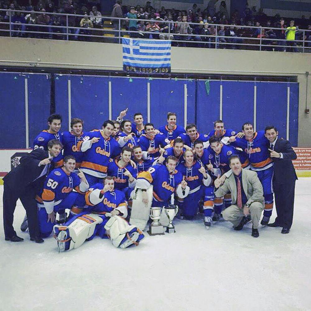 The UF club men’s ice hockey team poses for a picture after winning the Savannah Tire Hockey Classic tournament.