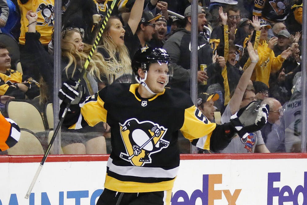 <p>FILE - In this Oct. 16, 2019, file photo, Pittsburgh Penguins' Jake Guentzel celebrates after scoring during the second period of an NHL hockey game against the Colorado Avalanche in Pittsburgh. Guentzel feared his season was over thanks to a shoulder injury in December. The "pause" caused by the pandemic has given him renewed optimism that he will be ready when the playoffs hopefully being this summer. (AP Photo/Gene J. Puskar, File)</p>