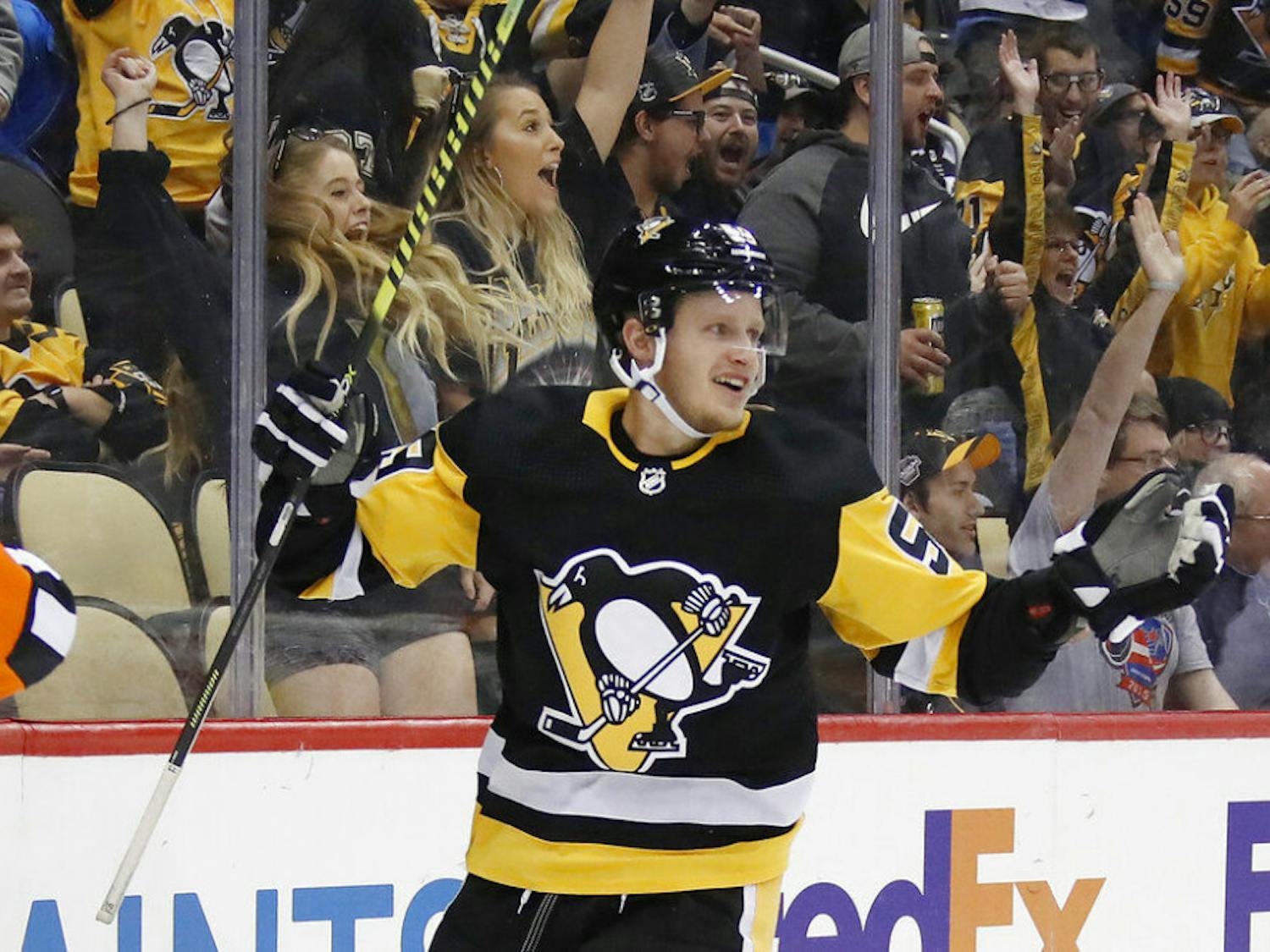 FILE - In this Oct. 16, 2019, file photo, Pittsburgh Penguins' Jake Guentzel celebrates after scoring during the second period of an NHL hockey game against the Colorado Avalanche in Pittsburgh. Guentzel feared his season was over thanks to a shoulder injury in December. The "pause" caused by the pandemic has given him renewed optimism that he will be ready when the playoffs hopefully being this summer. (AP Photo/Gene J. Puskar, File)