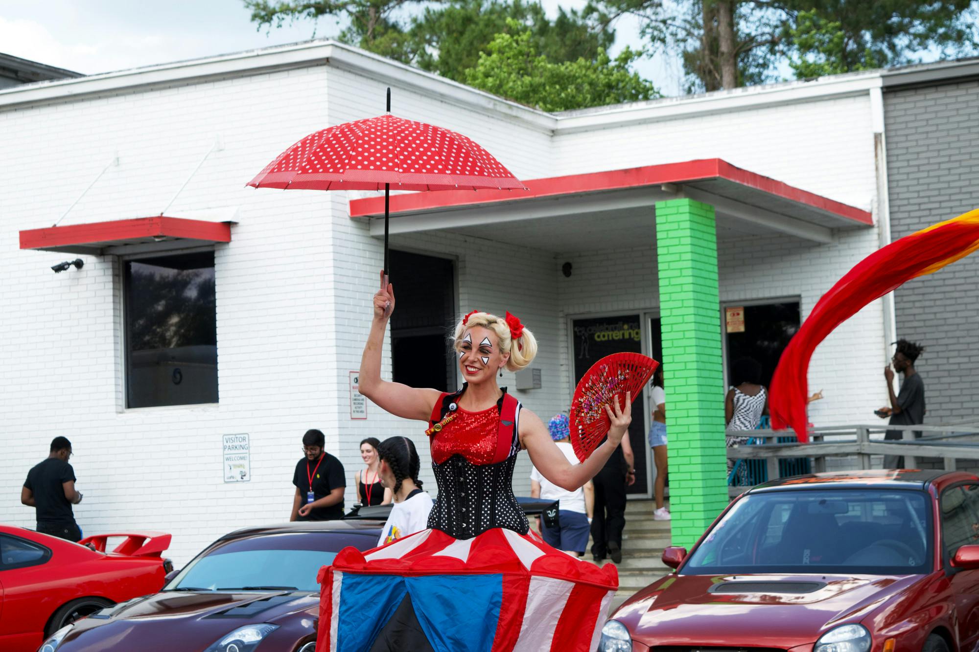 A circus performer entertains attendees during the Big Sho at Celebration Catering Warehouse on Saturday, April 15, 2023.