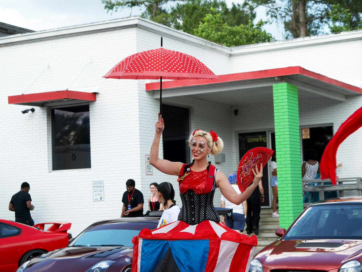 A circus performer entertains attendees during the Big Sho at Celebration Catering Warehouse on Saturday, April 15, 2023.