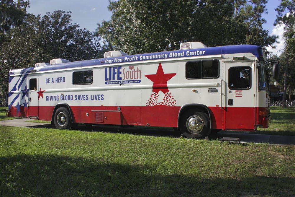 <p>A bloodmobile is parked on the North Lawn behind the Hub on Sept. 14, 2015.</p>