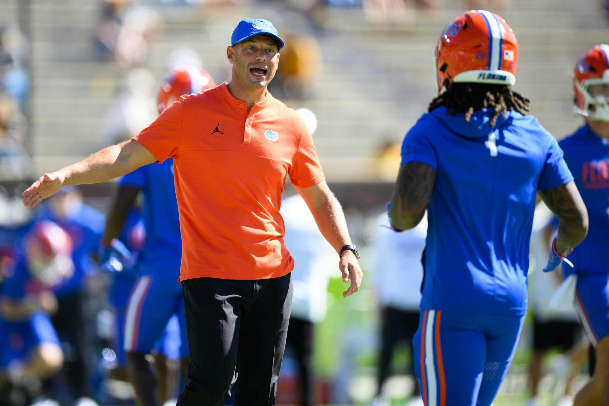 Florida head coach Jon Sumrall high fives Florida safety Bryce Thornton (1) before an NCAA college football game against Missouri, Saturday, Oct. 3, 2026, in Columbia, Mo.