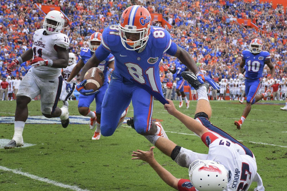 <p>UF wide receiver Antonio Callaway is tackled by FAU punter Dalton Schomp during a punt return in Florida's 20-14 overtime win against Florida Atlantic on Nov. 21, 2015, at Ben Hill Griffin Stadium.</p>