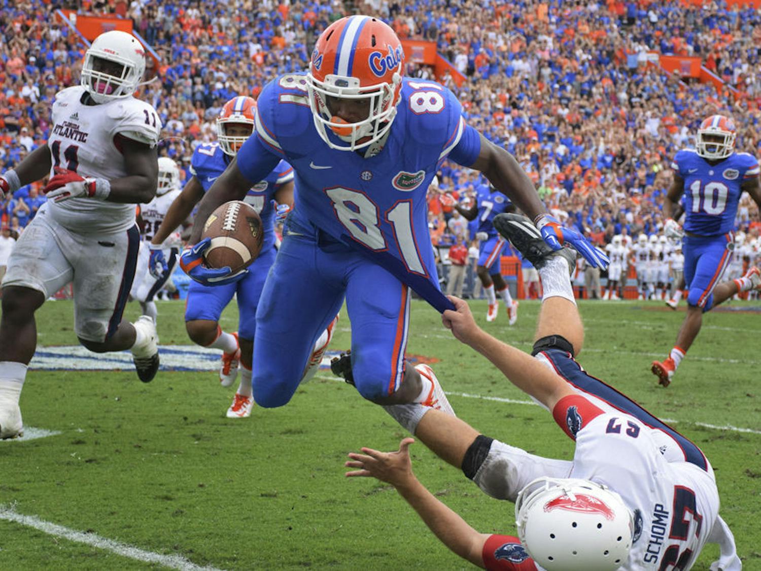 UF wide receiver Antonio Callaway is tackled by FAU punter Dalton Schomp during a punt return in Florida's 20-14 overtime win against Florida Atlantic on Nov. 21, 2015, at Ben Hill Griffin Stadium.