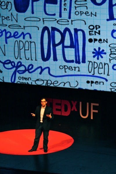 Michael Jones speaks about content sharing at TEDxUF in the Curtis M. Phillips Center for the Performing Arts on Saturday. Jones is working to develop the world's largest database of open educational material.