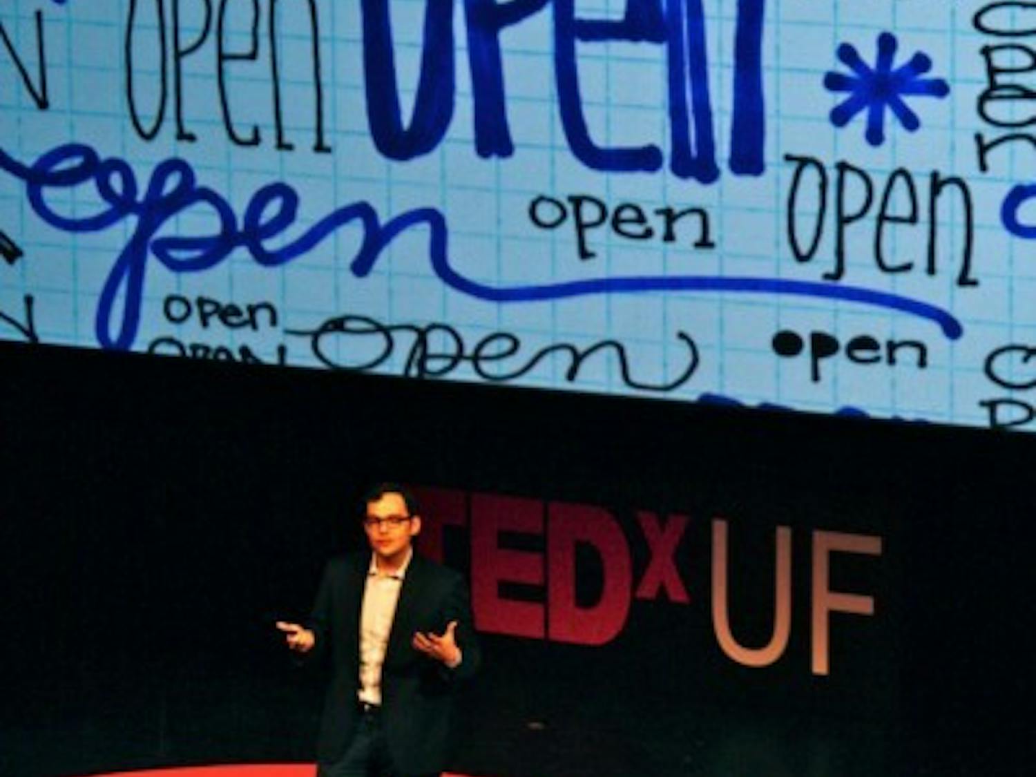 Michael Jones speaks about content sharing at TEDxUF in the Curtis M. Phillips Center for the Performing Arts on Saturday. Jones is working to develop the world's largest database of open educational material.