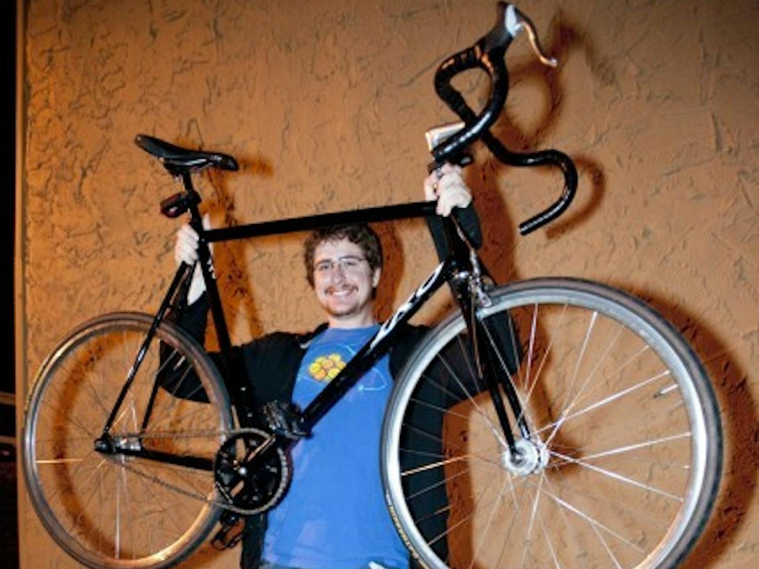 Samuel B. Gause, 22, a chemistry graduate student, poses with his returned bike on Monday night.