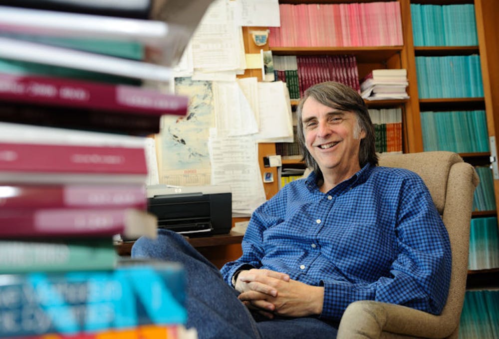 <p>UF economics professor Mark Rush poses in his office in Matherly Hall.</p>