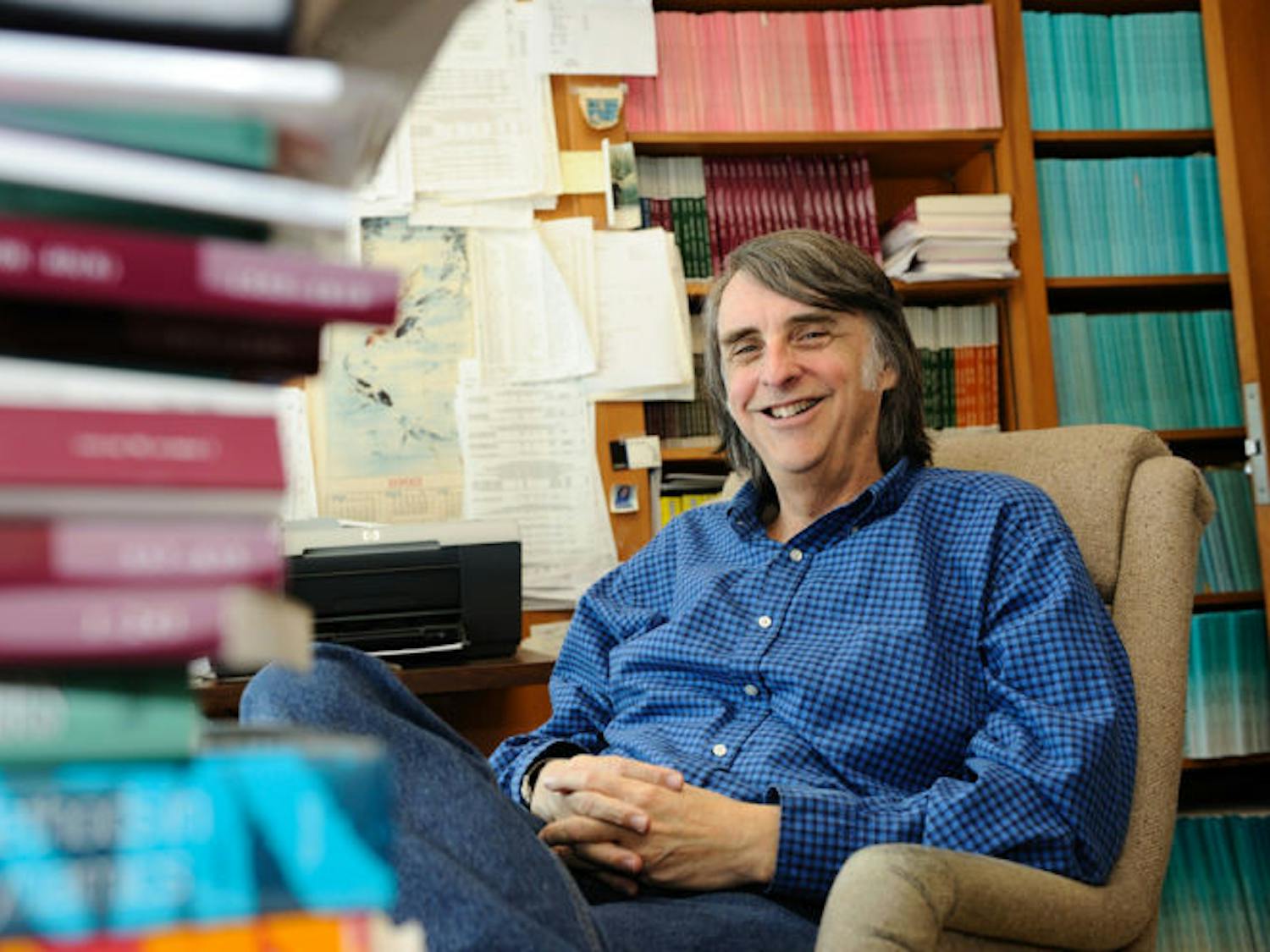 UF economics professor Mark Rush poses in his office in Matherly Hall.