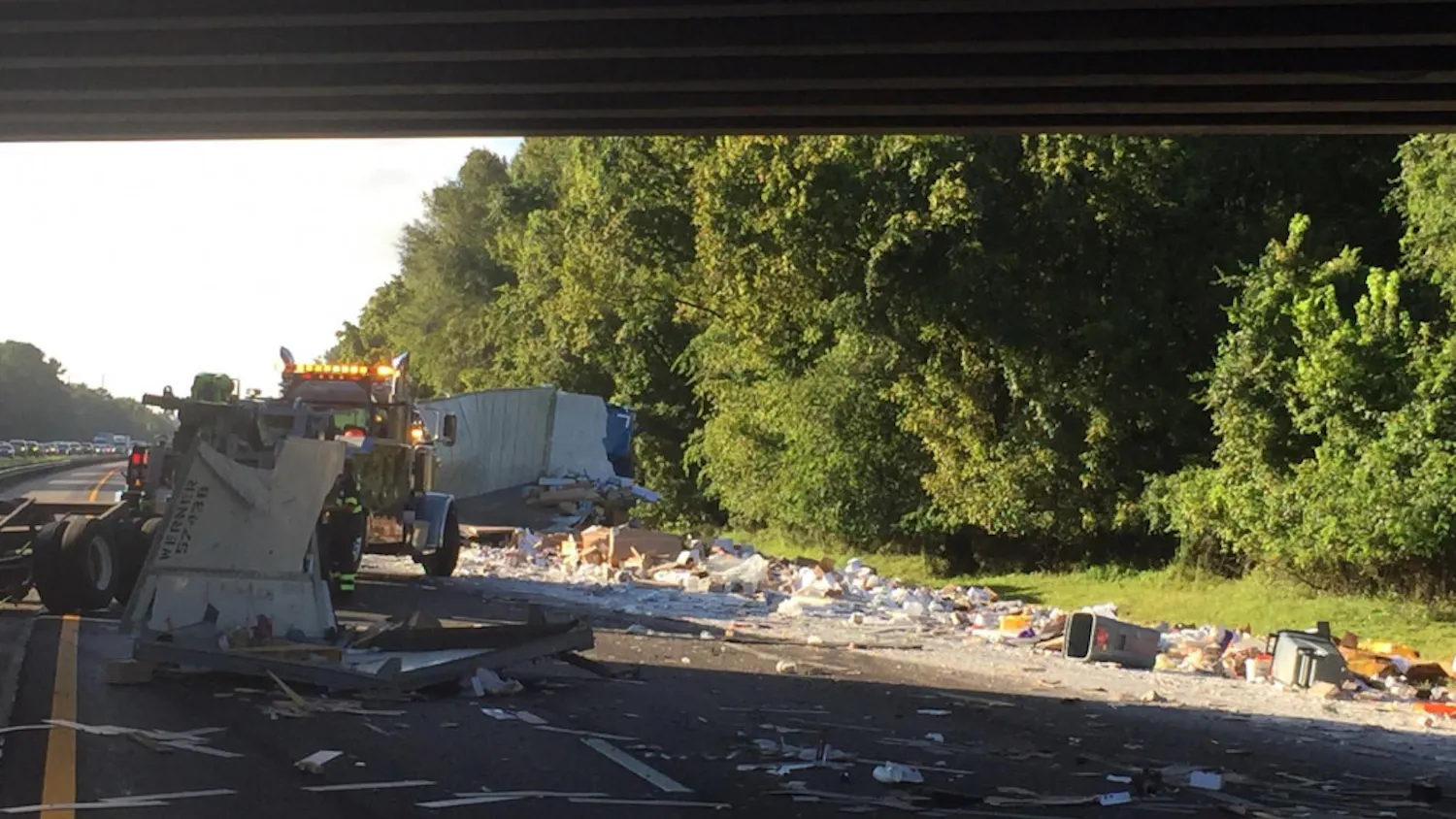 Construction materials spilled over all three Southbound lanes on Interstate 75 after a semi tipped over Friday morning.