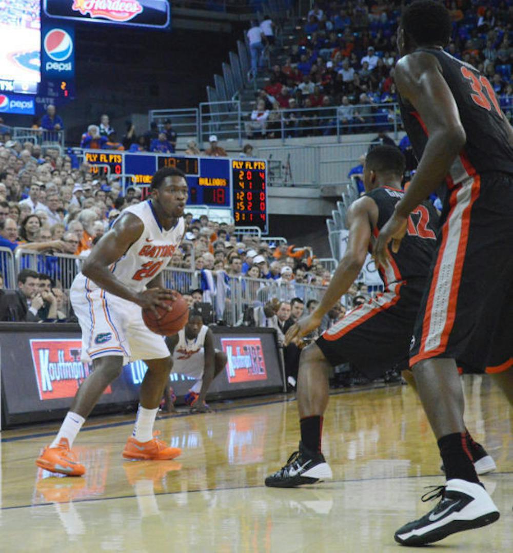 <p>Michael Frazier II prepares to shoot during Florida’s 72-50 win against Georgia on Tuesday in the O’Connell Center. Frazier finished with a career-high 21 points.</p>