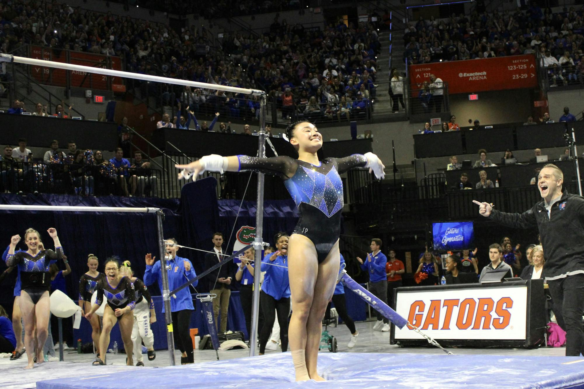 Leanne Wong dismounts after her bar routine against the Auburn Tigers Friday, Jan. 13, 2023. 