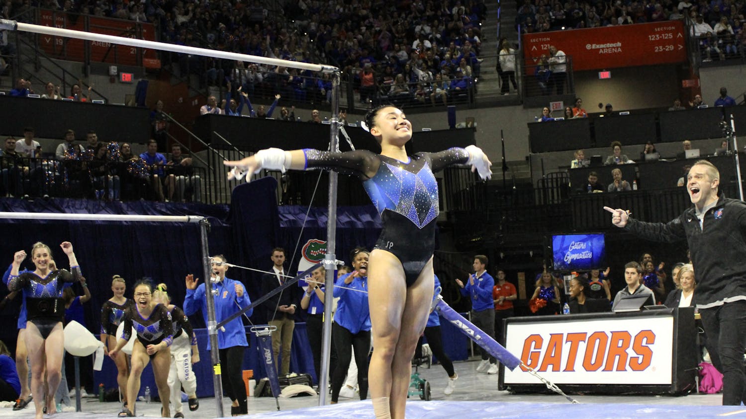 Leanne Wong dismounts after her bar routine against the Auburn Tigers Friday, Jan. 13, 2023. 