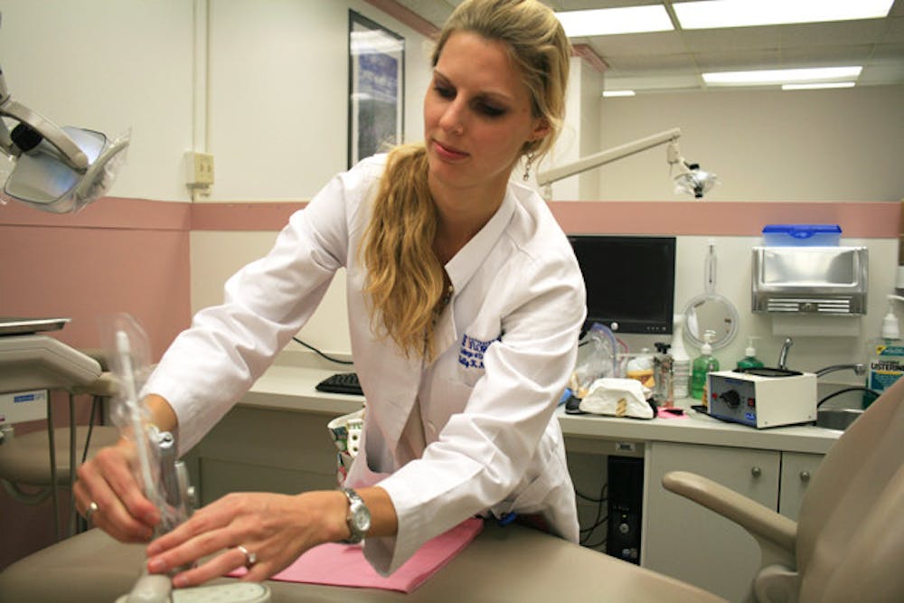 <p>Kelly Nedimyer, a fourth-year dental student, sees patients ranging from 15 to 94 years old at the UF College of Dentistry's clinic.</p>