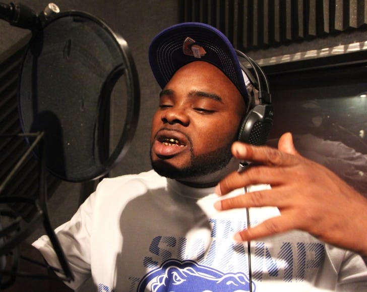 Daryl Brown, known as Deal’a, recites a verse from his new song, “It’s a Swamp Thang,” in the booth at Crescendo Sound Studios, 2106 Northwest 67th Place No. 6.
