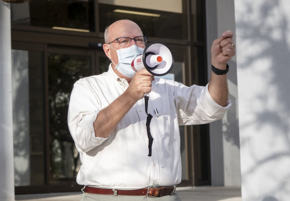 Gainesville Commissioner for district 2, Harvey Ward, is seen giving a short speech during the "Protect the Results" rally held at the Alachua City Hall on Wednesday, Nov. 4, 2020. (Emily Felts/Alligator Staff)