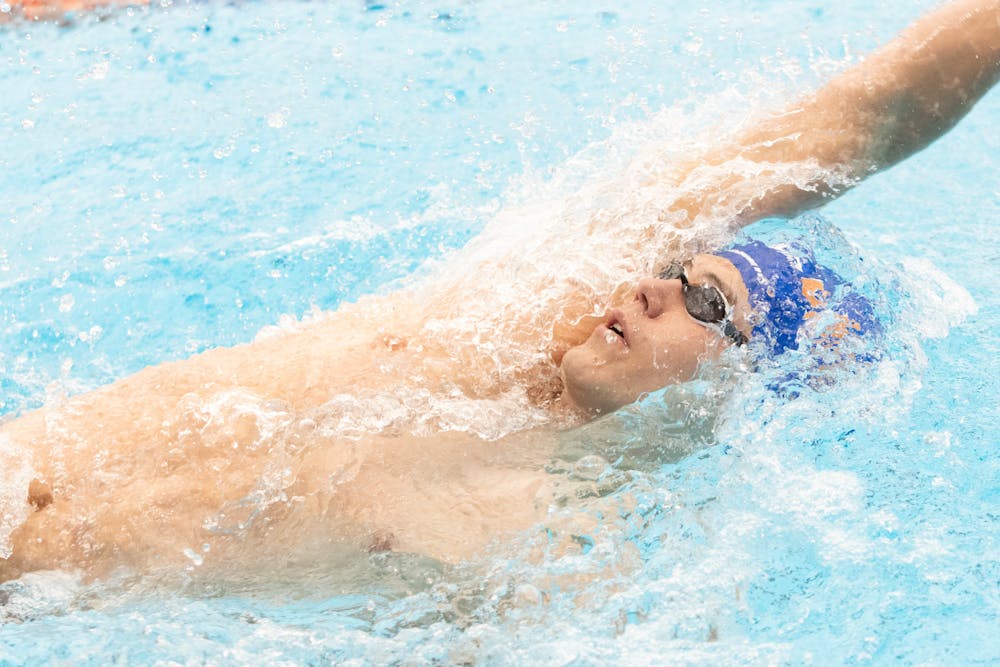 Freshman Amadeusz Knop completes a backstroke in the Florida Invitational against Nova Southeastern, Friday, Feb. 2, 2024. 