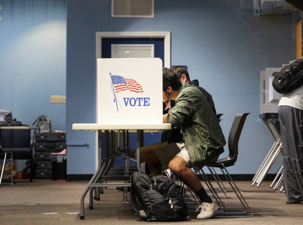 Nestor Garcia, a 21-year-old industrial engineer major, attends the early voting session on Oct. 22, 2018, at the J. Wayne Reitz Union to vote for the first time.