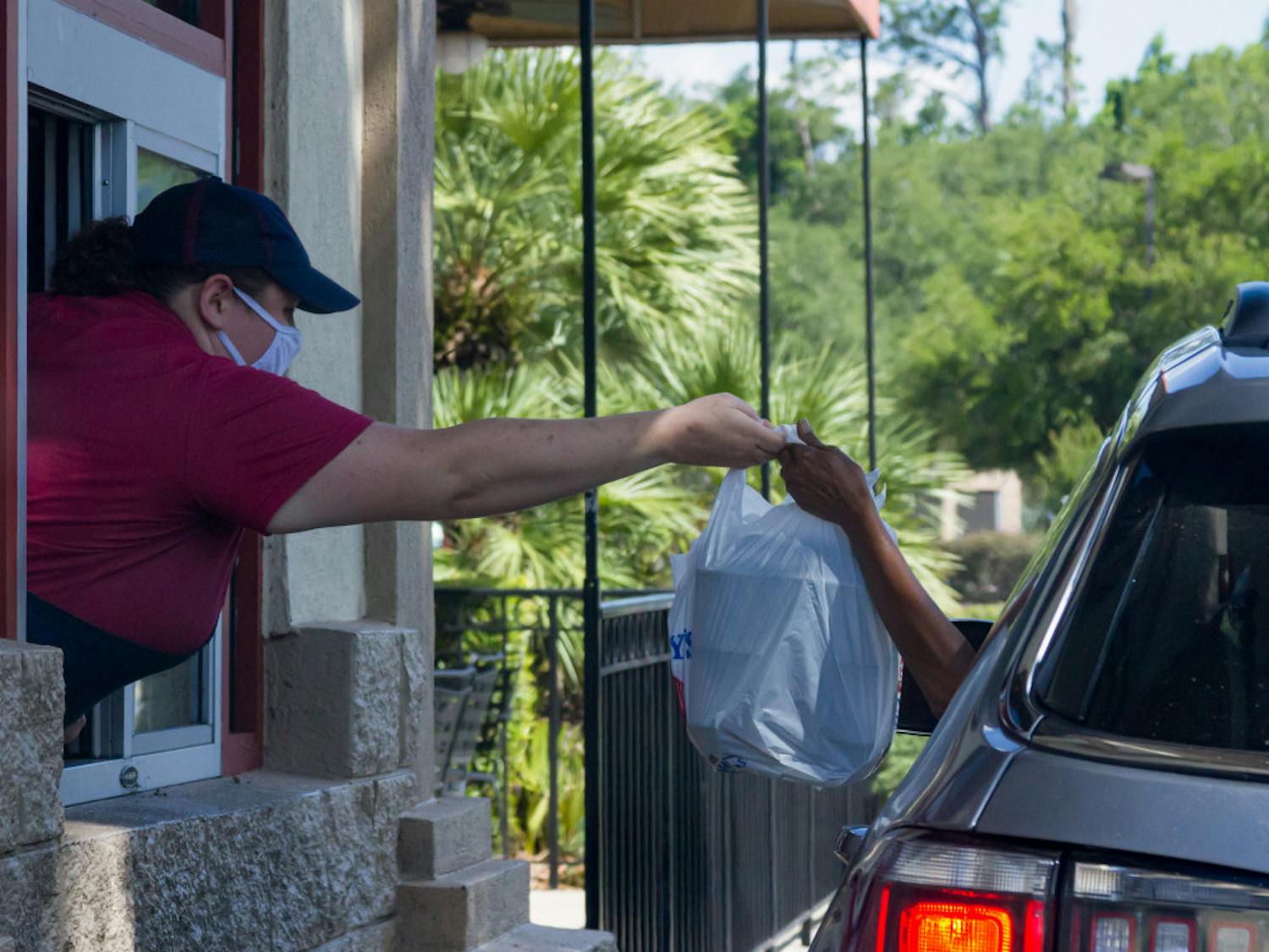 A global pandemic does not stop fast-food businesses. As drive-thrus continue to overflow with customers, workers continue to provide.
