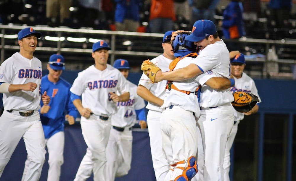 <p>UF reliever Tyler Dyson celebrates with catcher Mike Rivera following Florida's 1-0 win against LSU on Friday at McKethan Stadium.&nbsp;</p>