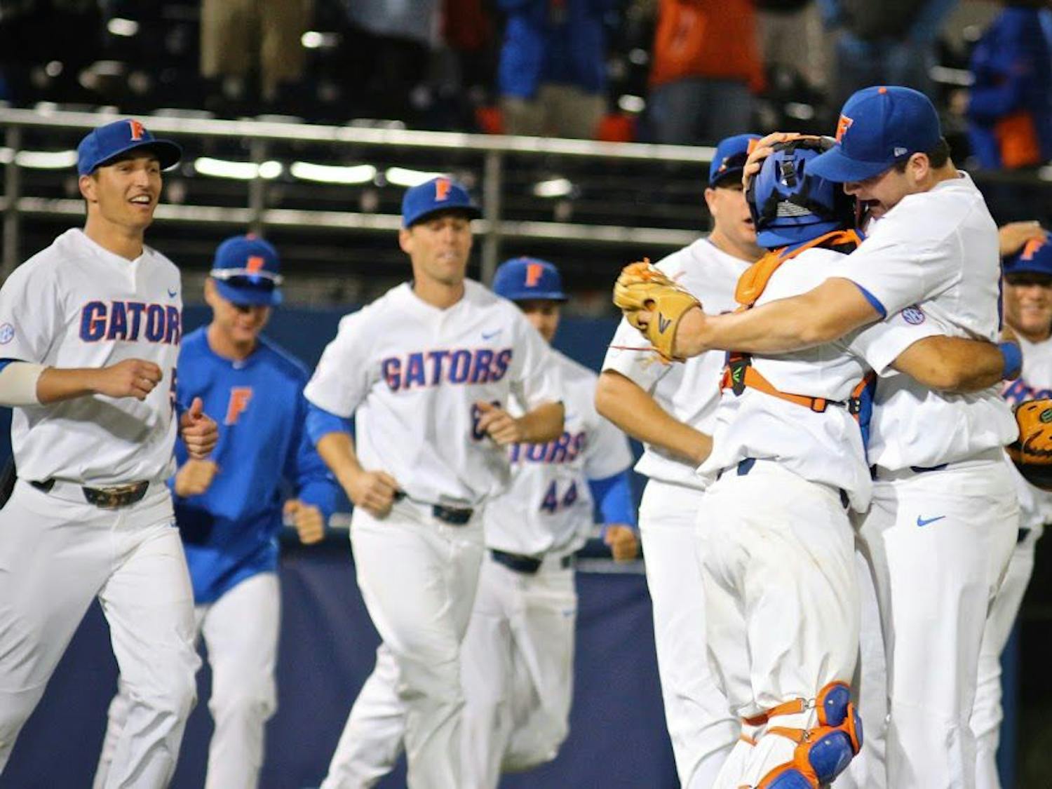 UF reliever Tyler Dyson celebrates with catcher Mike Rivera following Florida's 1-0 win against LSU on Friday at McKethan Stadium. 