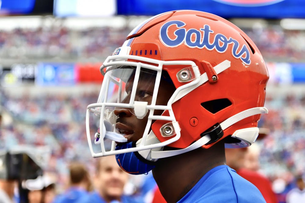 A close-up photo of a Florida player wearing his helmet
