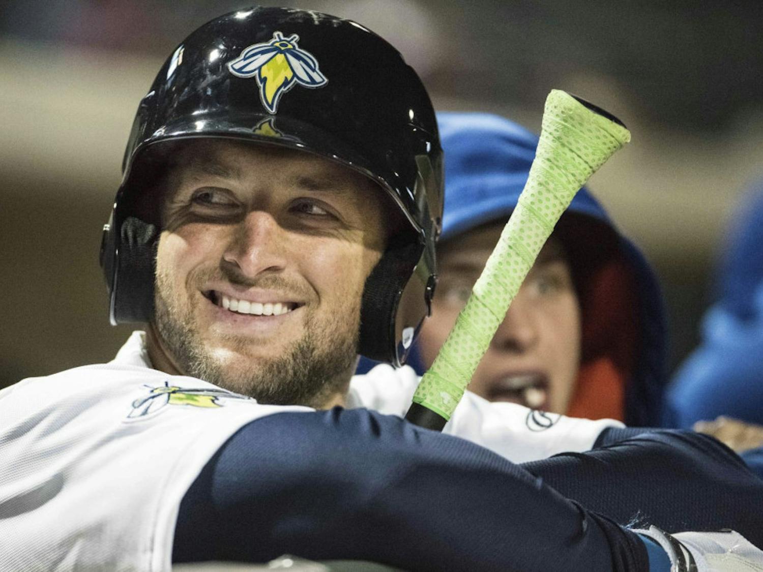 Columbia Firefly outfielder Tim Tebow shares a smile with fans during a Class A minor league baseball game against the Augusta GreenJackets on Thursday, April 6, 2017, in Columbia, S.C. Columbia defeated Augusta 14-7. (AP Photo/Sean Rayford)