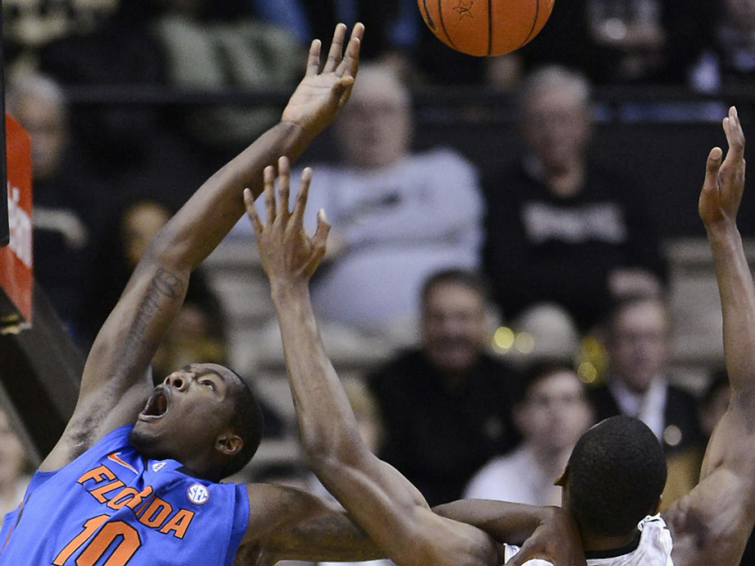 Dorian Finney-Smith (10) is fouled by Vanderbilt forward Rod Odom (0) during the Gators’ 57-54 win against the Commodores on Tuesday in Nashville, Tenn.
