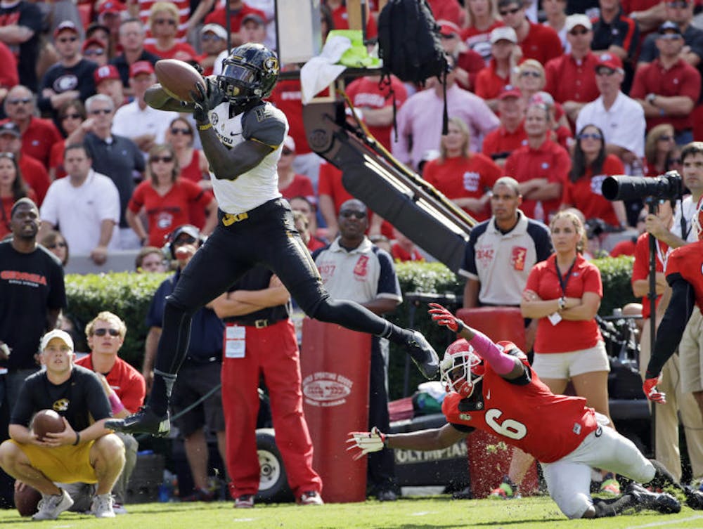 <p>Dorial Green-Beckham (middle) makes a catch as Georgia’s Shaq Williams defends during the second half of Missouri’s 41-26 victory on Oct. 12 in Athens, Ga. No. 14 Missouri hosts No. 22 Florida on Saturday.</p>