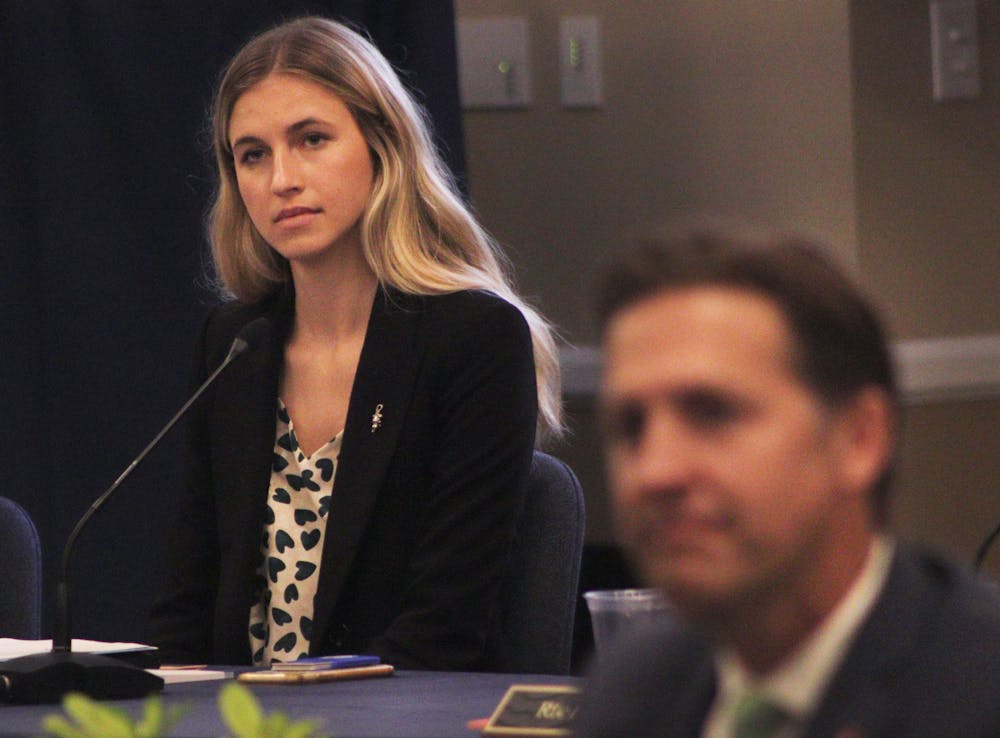 Lauren Lemasters, UF’s Student Body president, listens to public comment at the Board of Trustees confirmation vote Tuesday, Nov. 1, 2022. Some students have criticized her pro-Sasse vote amid student backlash.