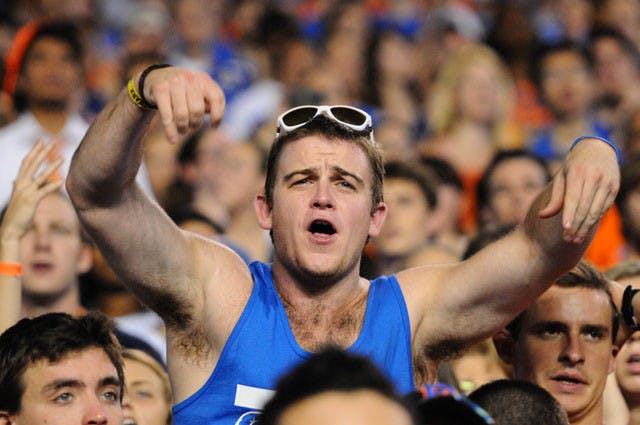 A student standing on the bleachers protests a call at the game against UAB on Saturday. Twenty-three people were ejected from Ben Hill Griffin Stadium for standing on bleachers.