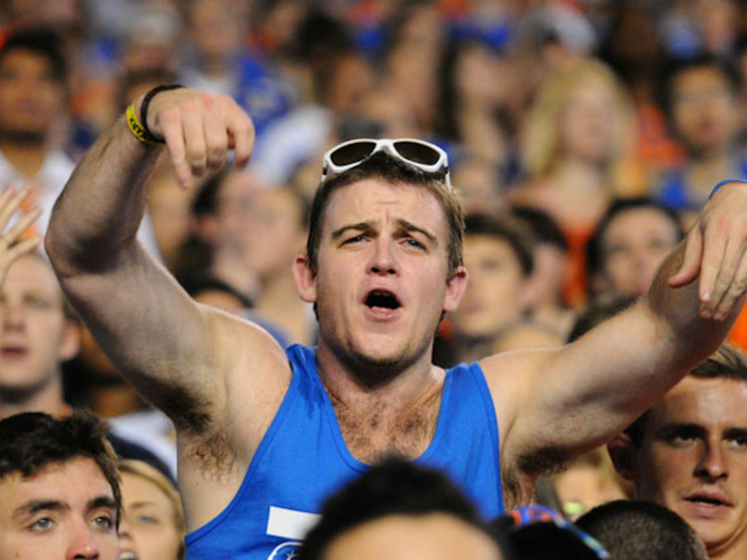 A student standing on the bleachers protests a call at the game against UAB on Saturday. Twenty-three people were ejected from Ben Hill Griffin Stadium for standing on bleachers.