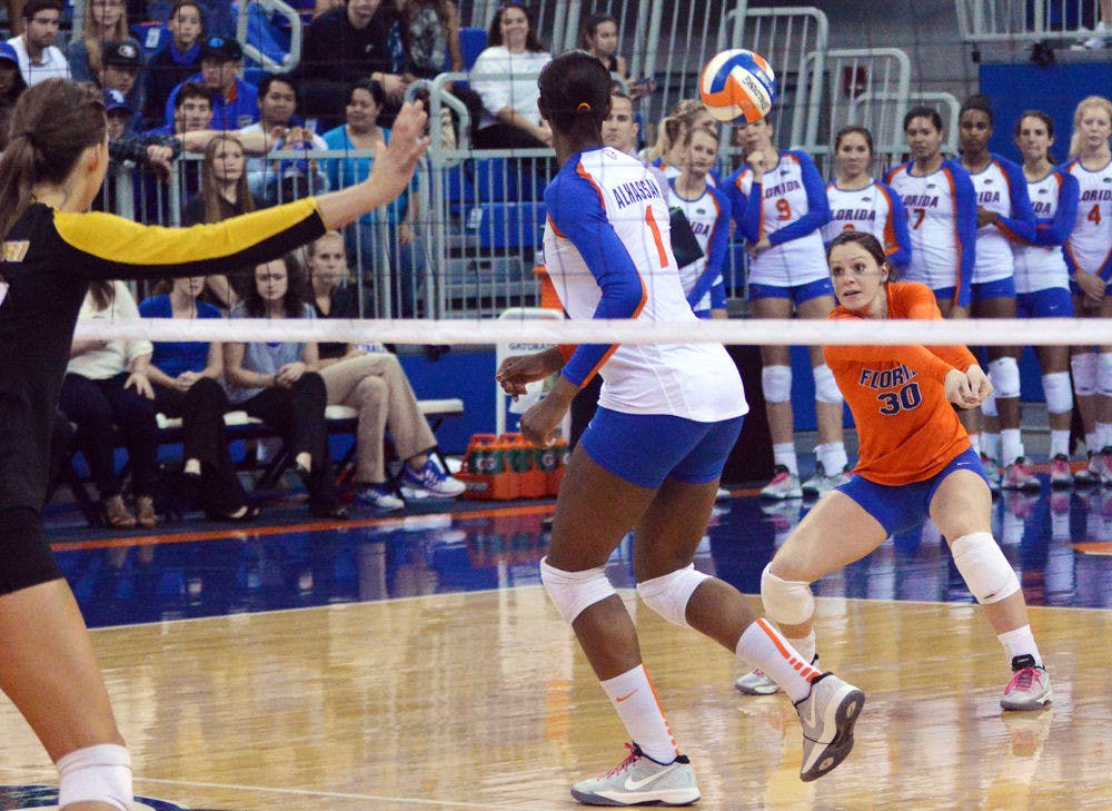 <p>Libero Holly Pole (30) prepares to dig a ball during Florida's 3-0 win against Missouri in the O'Connell Center.</p>