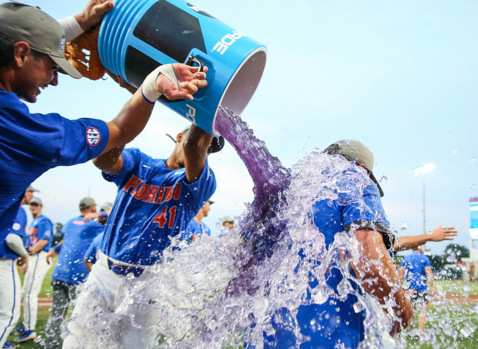 Florida baseball sophomores Jac Caglianone and Blake Purnell give head coach Kevin O’Sullivan a Powerade bath after the Gators’ 4-0 win against South Carolina Saturday, June 10, 2023.