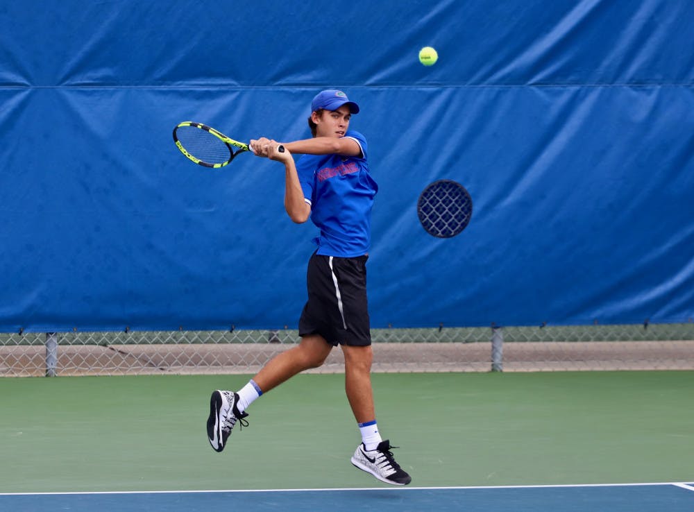 Sophomore Greysen Cacciatore split his two singles matches Thursday, failing to qualify.
