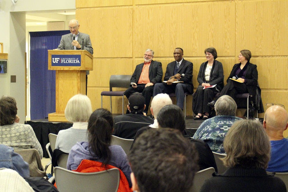 Bennet Brumme (left), former Miami-Dade public defender, moderated the event at Pugh Hall on Jan. 13, 2016. About 100 UF students and Gainesville residents attended to listen to the three panelists discuss Alachua’s criminal justice system.