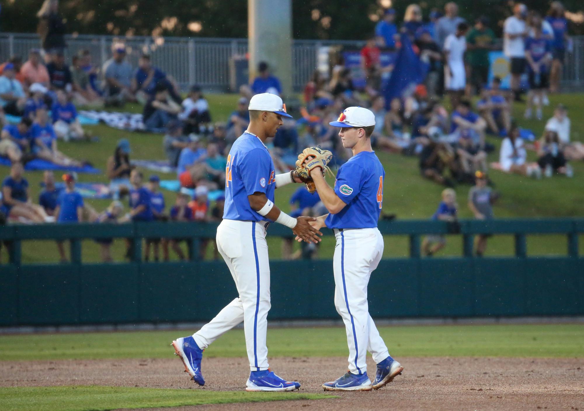 Florida infielders Cade Kurland and Josh Rivera shake hands during the Gators' 6-2 win against Vanderbilt Saturday, May 13, 2023. 