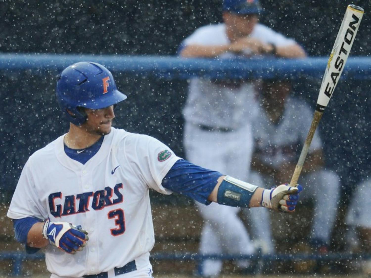 Mike Zunino bats in the seventh inning just before the first rain delay against N.C. State on Saturday. Zunino completed the at-bat with a home run two hours and three minutes later. 