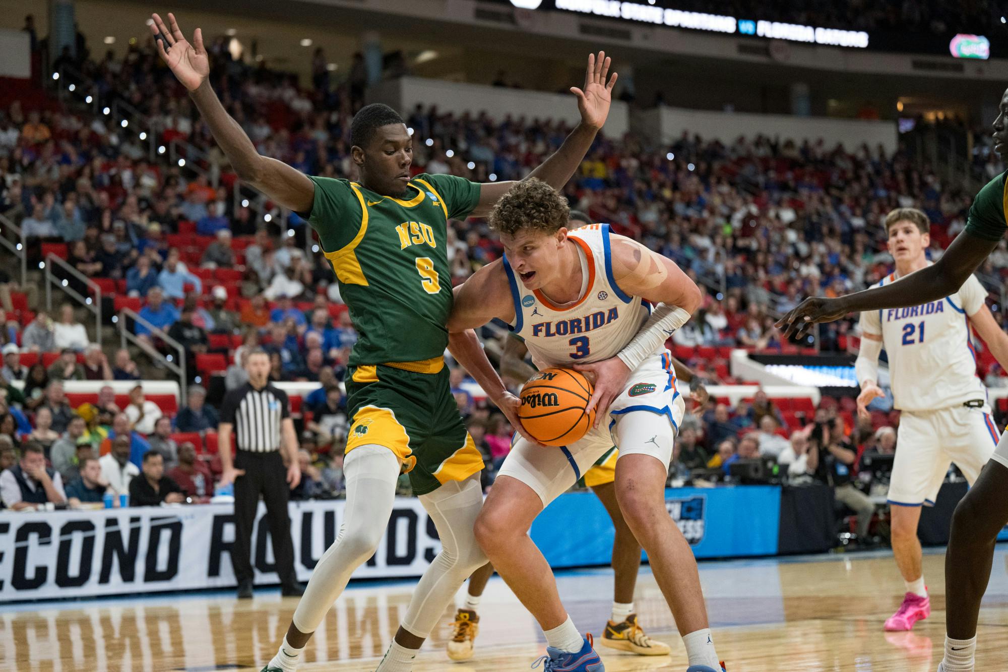Florida Gators center Micah Handlogten (3) drives with the ball during a basketball game against Norfolk State in the first round of the NCAA Tournament on Friday, March 21, 2025, in Raleigh, N.C.