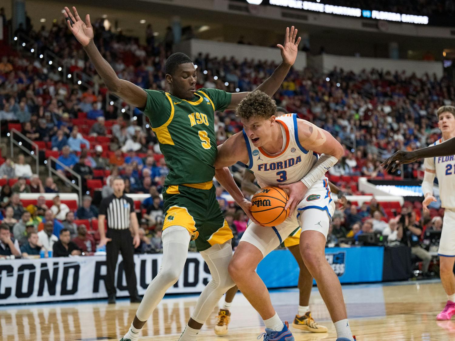 Florida Gators center Micah Handlogten (3) drives with the ball during a basketball game against Norfolk State in the first round of the NCAA Tournament on Friday, March 21, 2025, in Raleigh, N.C.