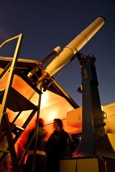 One of the telescopes at the UF Department of Astronomy's Teaching Observatory aims at the starry night sky. The observatory is free to the public every Friday from 8:30 to 10 p.m.