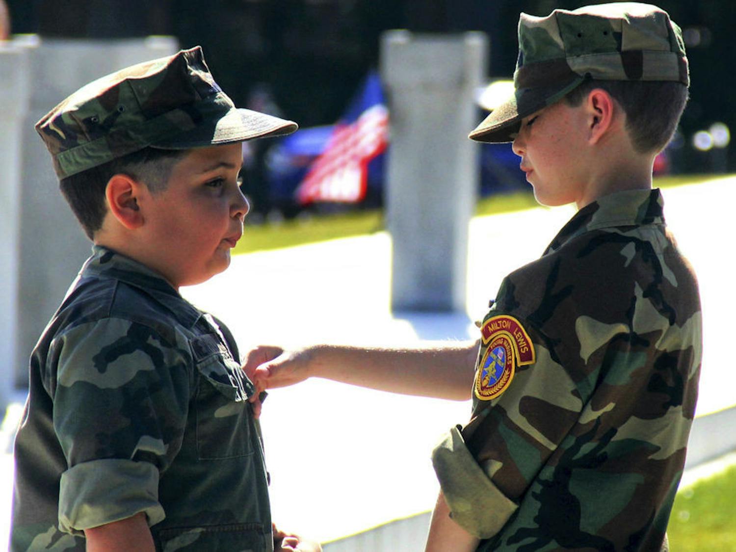 Pvt. Dylan Russell and Pfc. Richard Newman II prepare to participate in the Veterans Day ceremony. Both 9-year-old cadets&nbsp; from the Milton Lewis Young Marines received a ribbon.