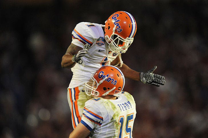 Quarterback Tim Tebow (15) embraces wide receiver Percy Harvin (1) during Florida’s 24-14 win against Oklahoma on Jan. 8, 2009, in the BCS National Championship Game in Miami.