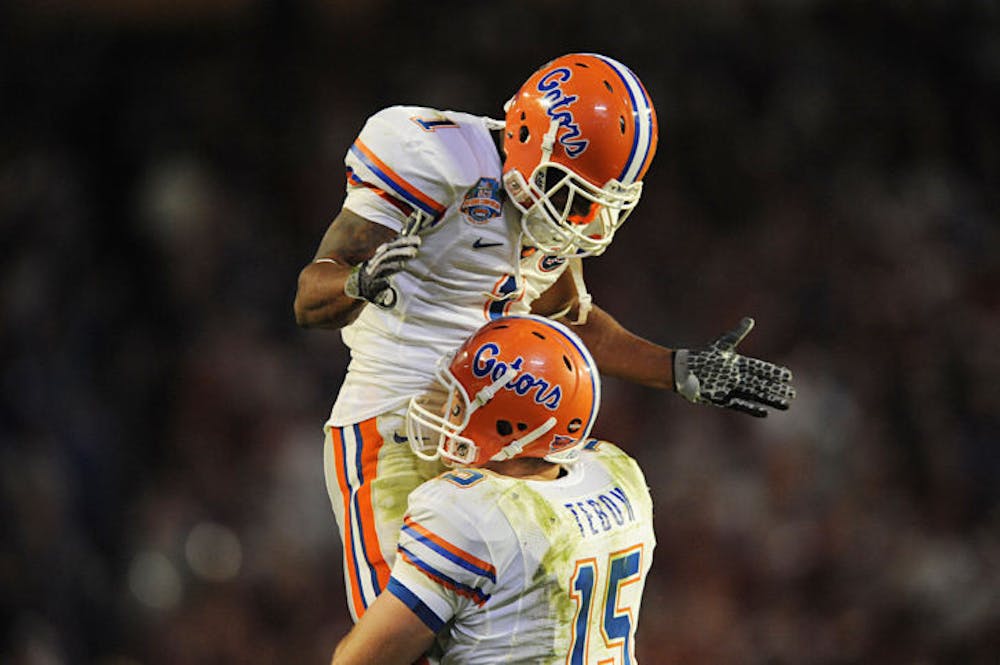 <p class="p1"><span class="s1">Quarterback Tim Tebow (15) embraces wide receiver Percy Harvin (1) during Florida’s 24-14 win against Oklahoma on Jan. 8, 2009, in the BCS National Championship Game in Miami.</span></p>
